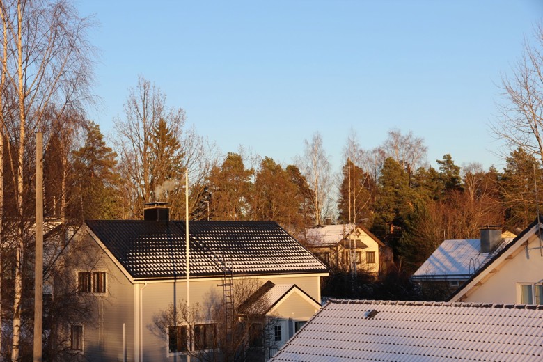 Houses in a detached housing area. Smoke is coming out of the chimney.